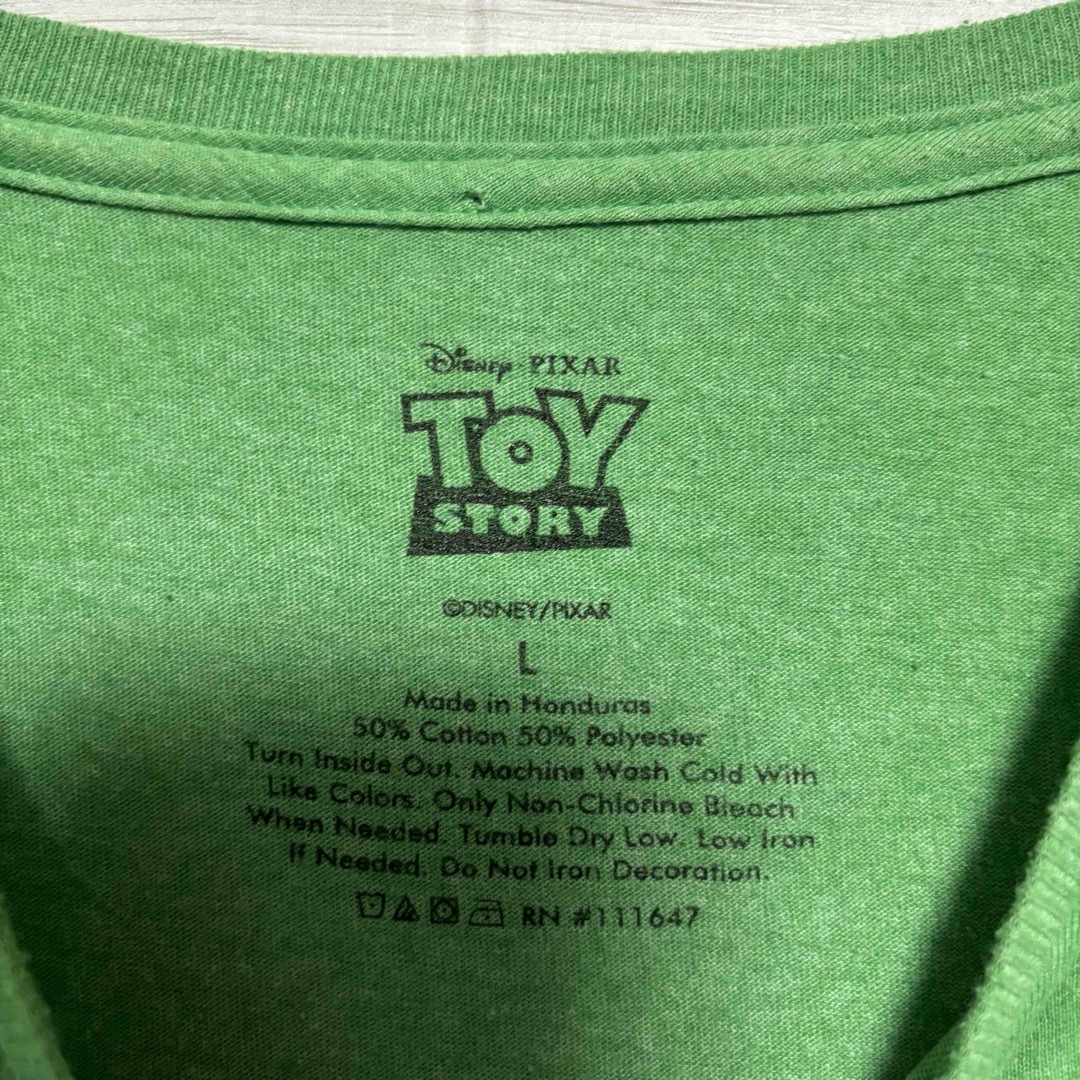 トイ・ストーリー(トイストーリー)の【希少デザイン】ディズニー　トイストーリー　レックス　Tシャツ　Lサイズ メンズのトップス(Tシャツ/カットソー(半袖/袖なし))の商品写真
