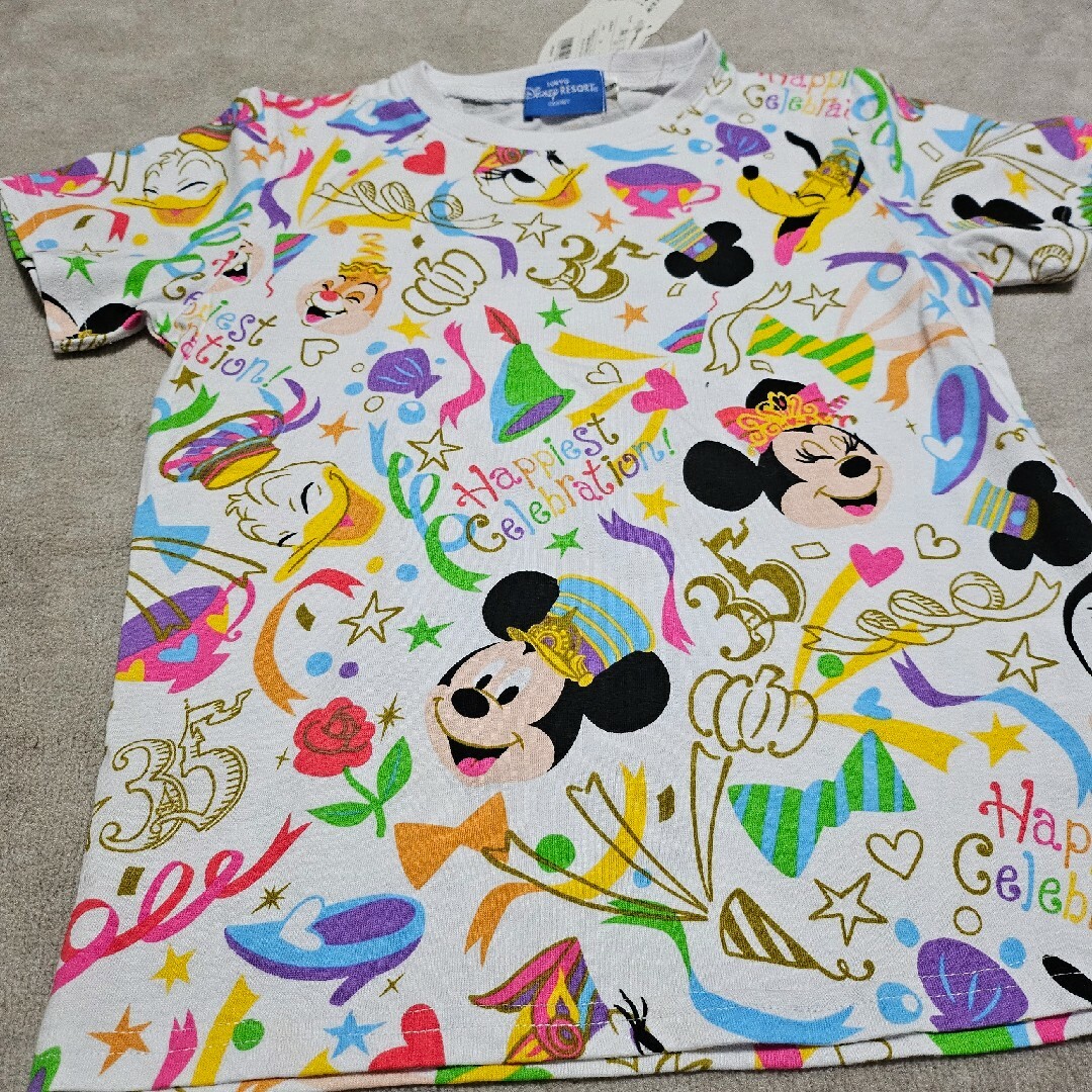 Disney(ディズニー)の東京ディズニーランド　35周年記念Tシャツ　タグ付き キッズ/ベビー/マタニティのキッズ服女の子用(90cm~)(Tシャツ/カットソー)の商品写真