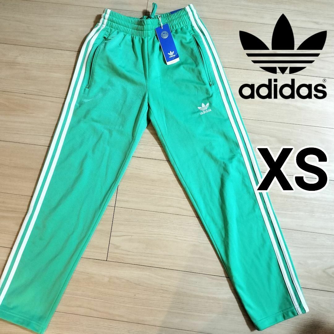 Originals（adidas）(オリジナルス)の新品 アディダス ファイヤーバード 薄緑 トラックパンツ ジャージ 男性XS メンズのパンツ(その他)の商品写真