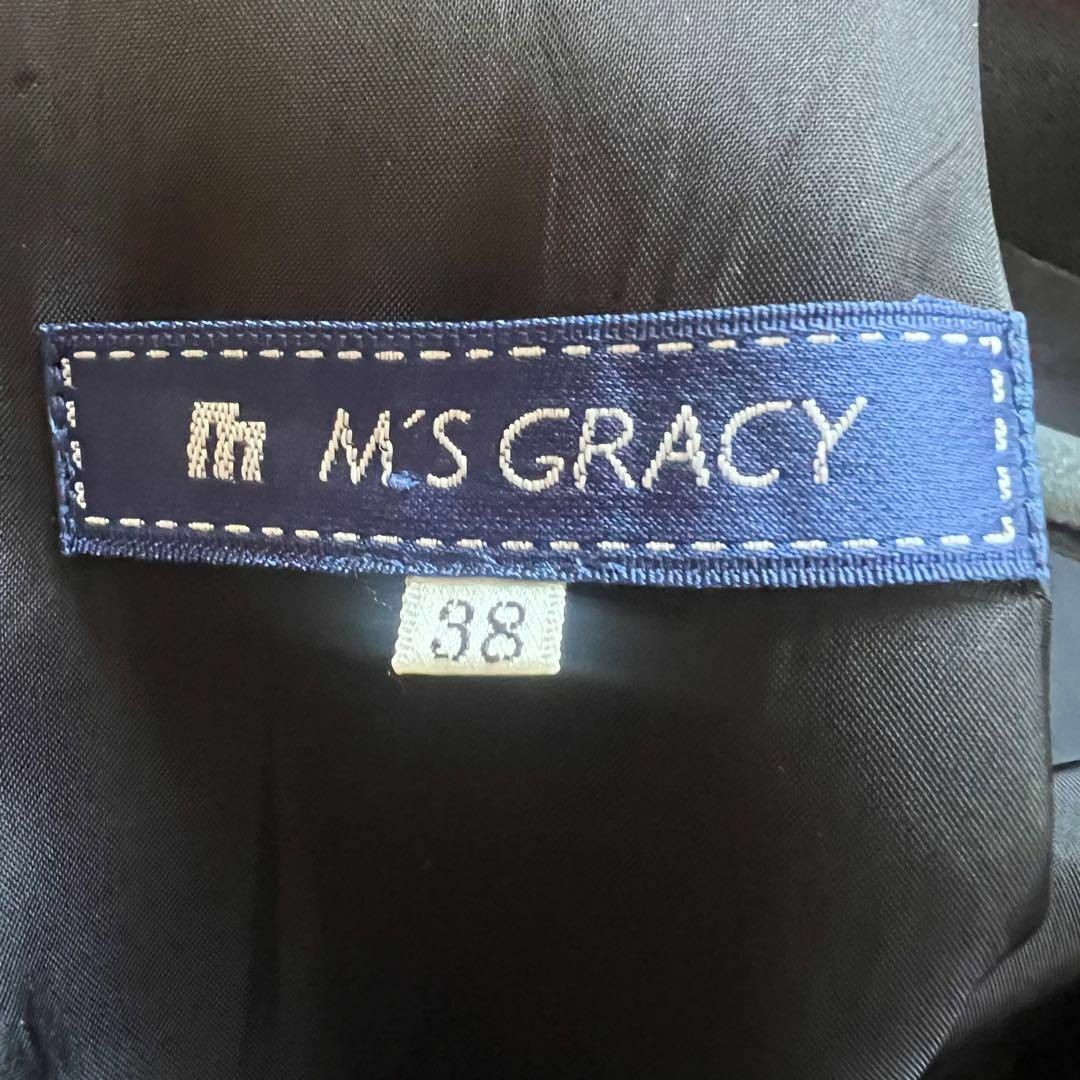 M'S GRACY(エムズグレイシー)の【美品】M'S GRACY リボンタイプリーツワンピース ブラック 膝丈 38 レディースのワンピース(ひざ丈ワンピース)の商品写真