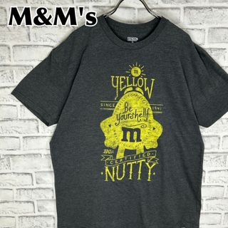 M&M's エムアンドエムズ イエロー NUTTY 企業 Tシャツ 半袖 輸入品(Tシャツ/カットソー(半袖/袖なし))