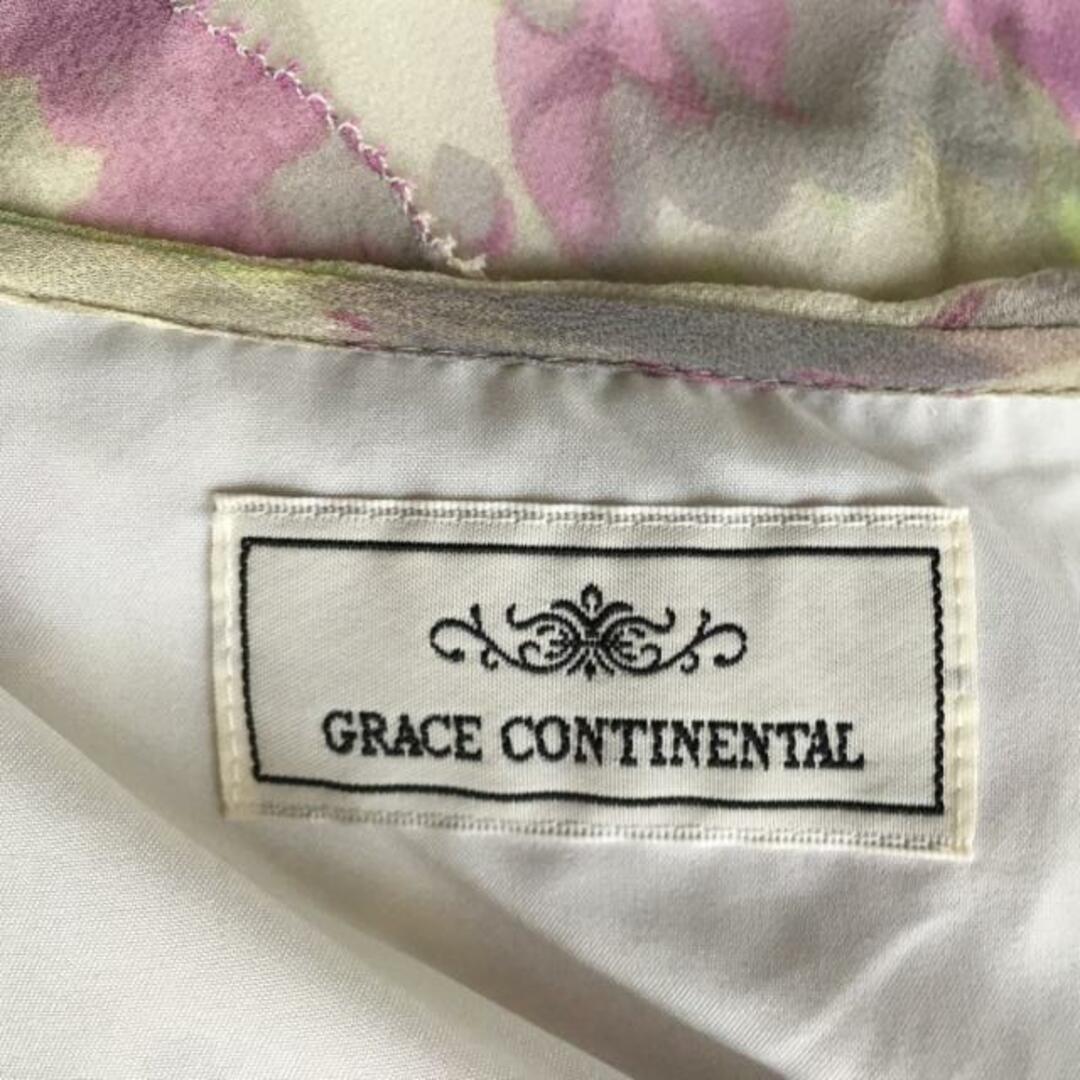 GRACE CONTINENTAL(グレースコンチネンタル)のGRACE CONTINENTAL(グレースコンチネンタル) チュニック サイズ38 M レディース - アイボリー×パープル×マルチ Vネック/七分袖/シルク レディースのトップス(チュニック)の商品写真