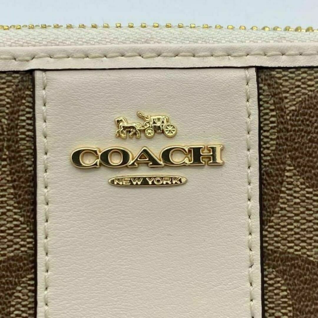 COACH(コーチ)の《未使用に近い　超美品》コーチ　シグネチャー　アコーディオン　ストライプ　長財布 レディースのファッション小物(財布)の商品写真