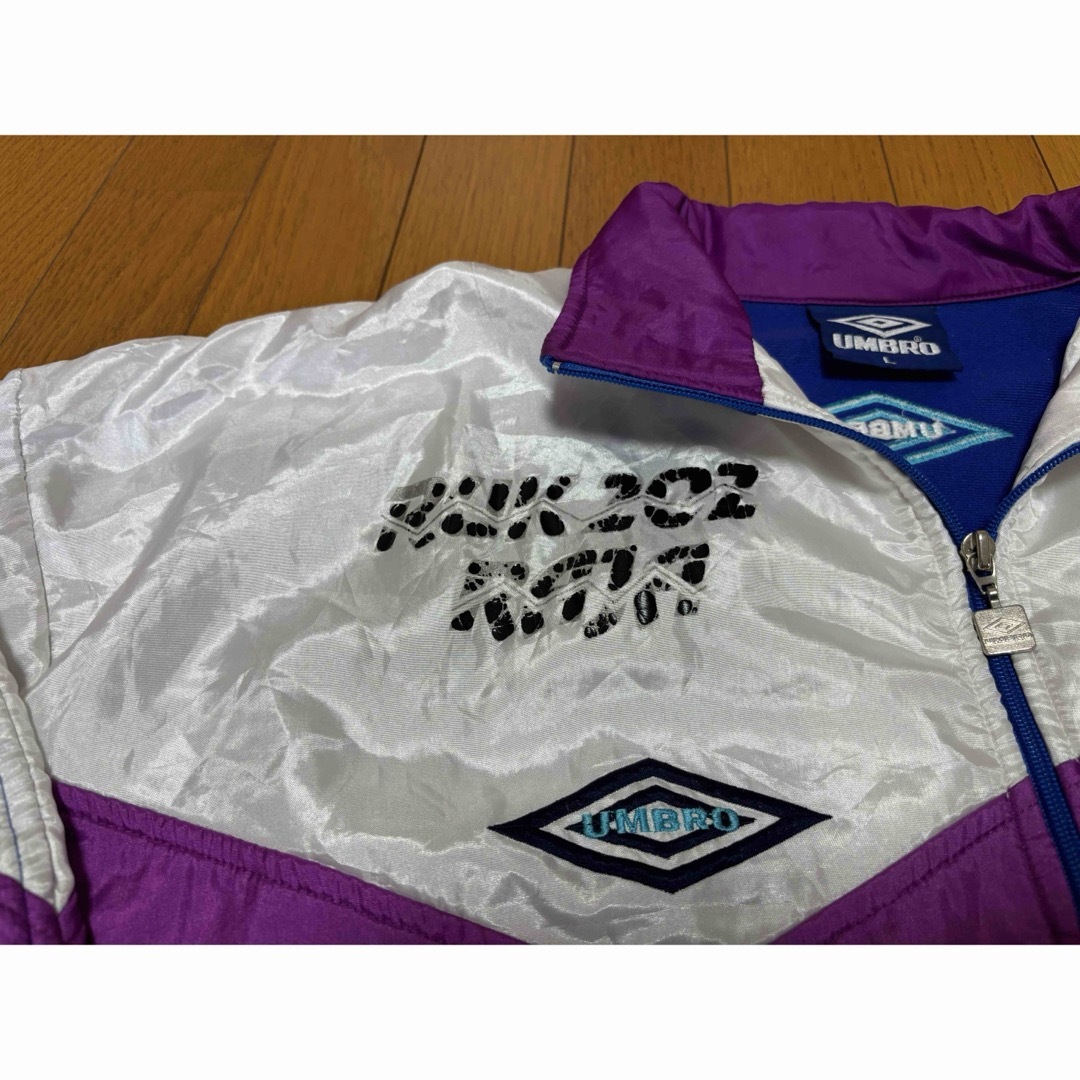 UMBRO(アンブロ)のumbro 90s トラックジャケット　デカタグ　サイズL ブルー　ハイネック メンズのトップス(ジャージ)の商品写真