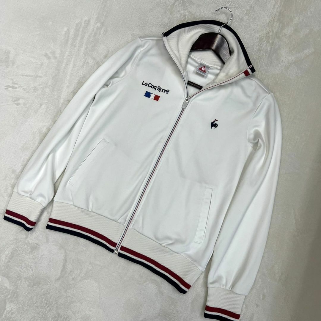 le coq sportif(ルコックスポルティフ)の【ルコックスポルティフ トラックジャケットジャージ レディースＭ ホワイト】 スポーツ/アウトドアのゴルフ(ウエア)の商品写真