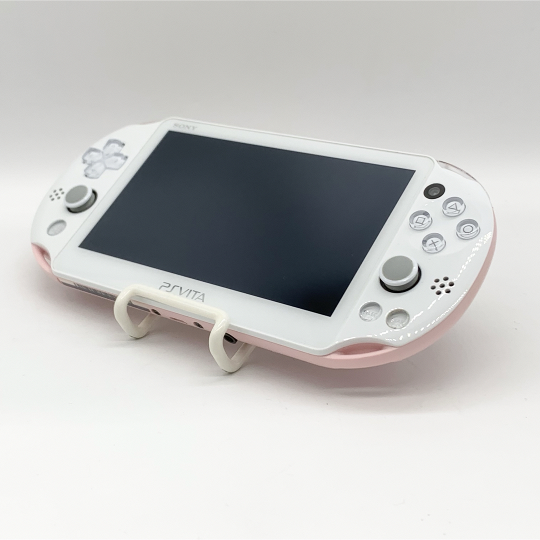 PlayStation Vita(プレイステーションヴィータ)の【液晶美品】PSvita ライトピンク ホワイト PCH-2000 本体 動作品 エンタメ/ホビーのゲームソフト/ゲーム機本体(携帯用ゲーム機本体)の商品写真