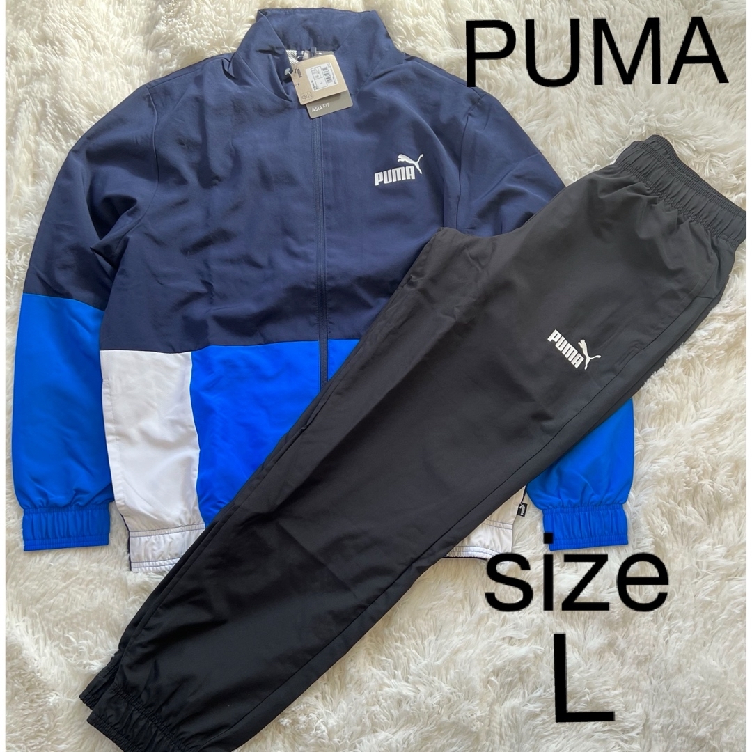 PUMA(プーマ)の新品！メンズ　PUMAウインドブレーカー上下セット　Lサイズ　ネイビー×ブルー メンズのトップス(ジャージ)の商品写真