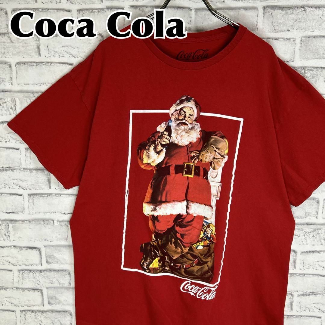 コカ・コーラ(コカコーラ)のCoca Cola コカコーラ サンタクロース XL 企業Tシャツ 半袖 輸入品 メンズのトップス(Tシャツ/カットソー(半袖/袖なし))の商品写真