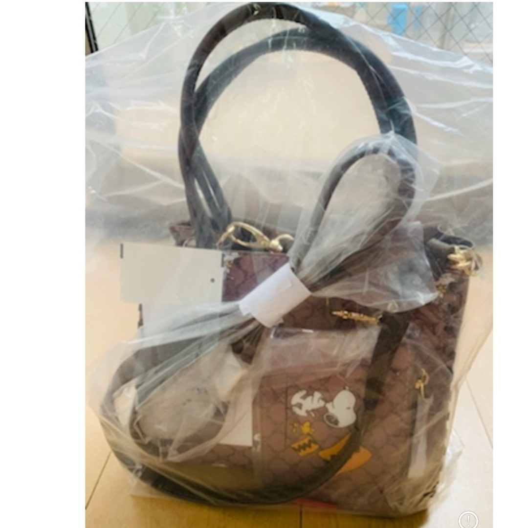 しまむら(シマムラ)のしまむら スヌーピー ポーチ付き2wayバッグ　総柄 薄茶色 ブラウン レディースのバッグ(ショルダーバッグ)の商品写真