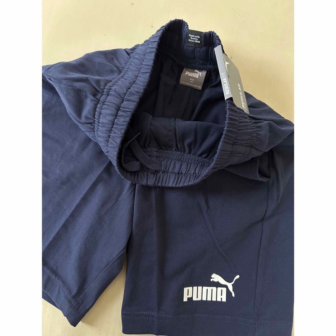 PUMA(プーマ)の新品タグ付き　130㎝ PUMAプーマ上下セットアップ　レッド×ネイビー キッズ/ベビー/マタニティのキッズ服男の子用(90cm~)(Tシャツ/カットソー)の商品写真