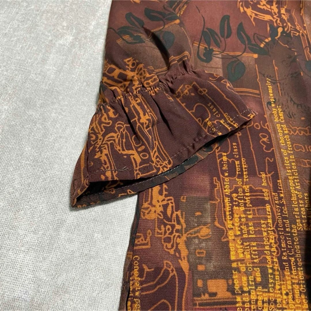 natuRAL vintage(ナチュラルヴィンテージ)のシャツ ブラウス 長袖 ハーフボタン アート ボタニカル アースカラー L レディースのトップス(シャツ/ブラウス(長袖/七分))の商品写真