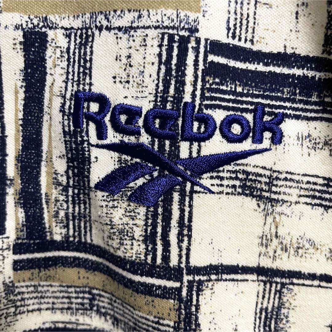 Reebok(リーボック)の美品　リーボックゴルフ　半袖ポロシャツ　総柄　刺繍ロゴ　メンズXLサイズ相当 メンズのトップス(ポロシャツ)の商品写真