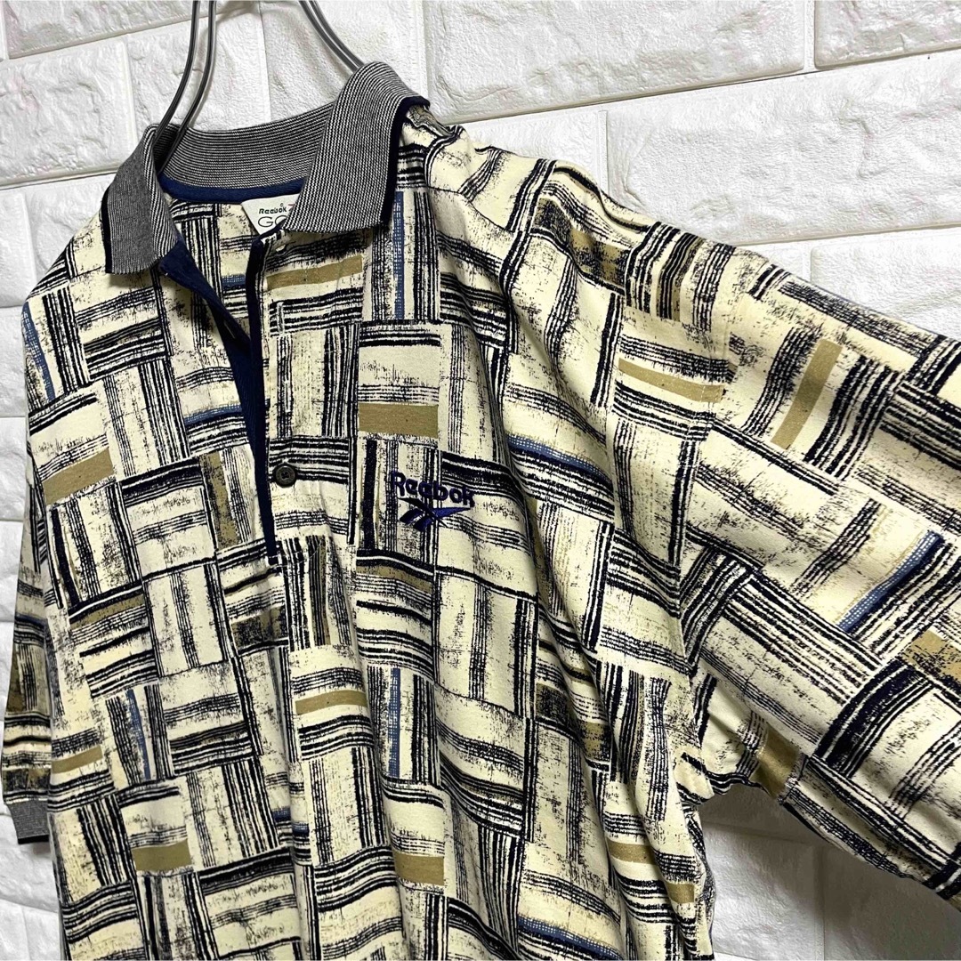 Reebok(リーボック)の美品　リーボックゴルフ　半袖ポロシャツ　総柄　刺繍ロゴ　メンズXLサイズ相当 メンズのトップス(ポロシャツ)の商品写真