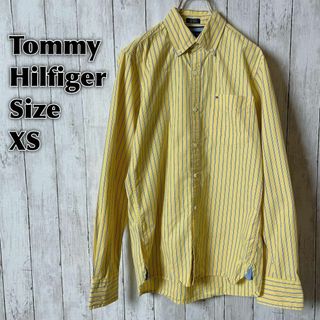 トミーヒルフィガー(TOMMY HILFIGER)のトミーヒルフィガー　黄色イエローストライプ　薄手長袖シャツ　サイズＸＳメンズ古着(シャツ)