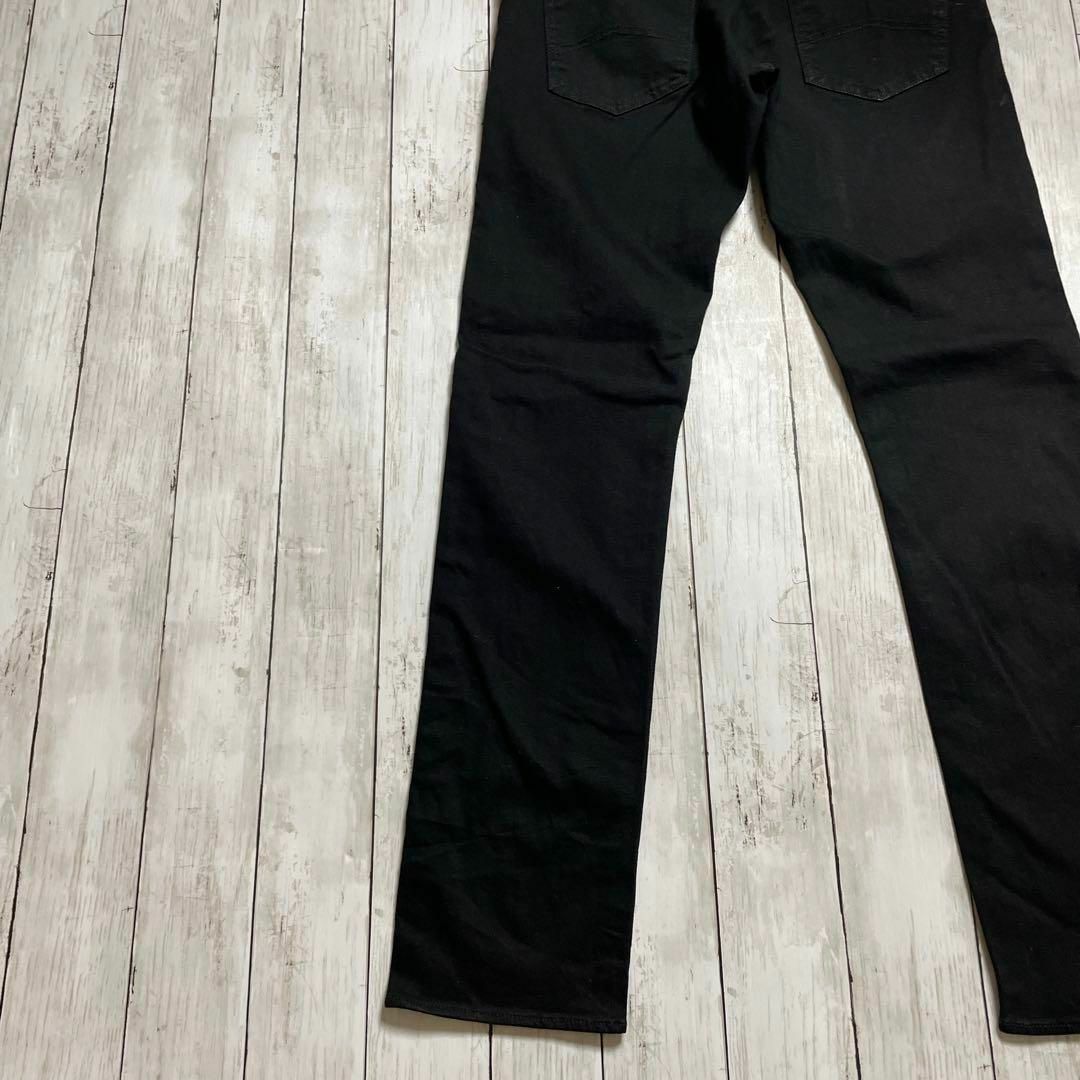 ARMANI EXCHANGE(アルマーニエクスチェンジ)のアルマーニ　ストレッチデニム　Ｗ30Ｌ30　黒ブラックやや薄手　メンズ　古着 メンズのパンツ(デニム/ジーンズ)の商品写真