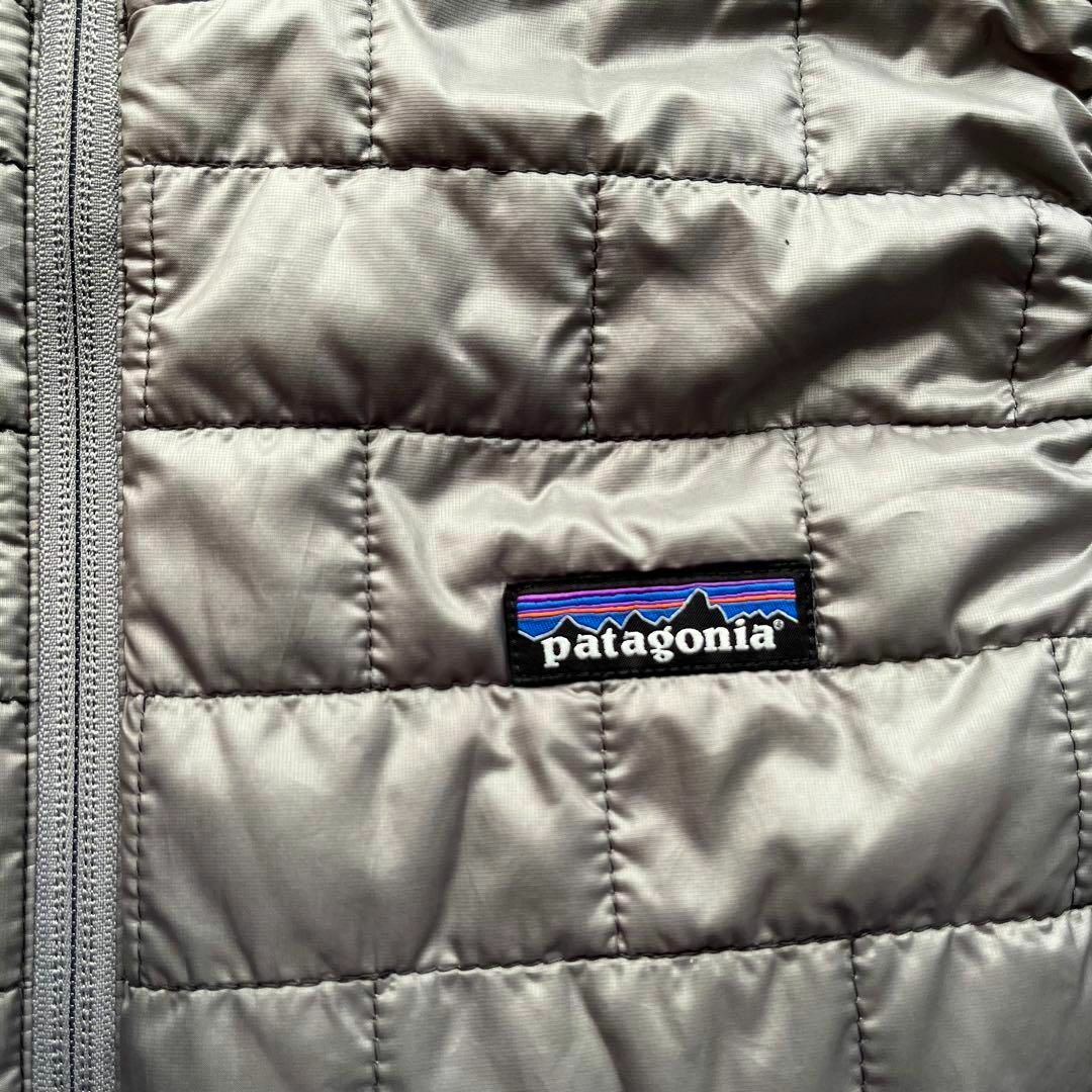 patagonia(パタゴニア)のパタゴニア　ナノパフ　ダウンベスト　グレー　Lサイズ　古着　プリマロフト レディースのジャケット/アウター(ダウンベスト)の商品写真