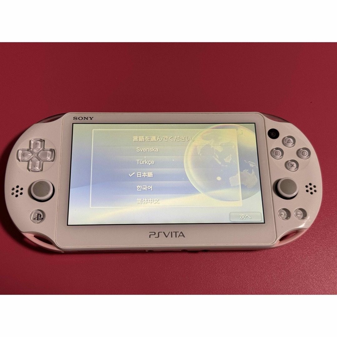 PlayStation Vita(プレイステーションヴィータ)のvita   ライトピンク　水没系　重度のジャンク エンタメ/ホビーのゲームソフト/ゲーム機本体(携帯用ゲーム機本体)の商品写真