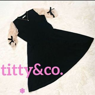 ティティアンドコー(titty&co)の【未使用】titty&co. シアー スリーブ リボン ニット ワンピース(ミニワンピース)