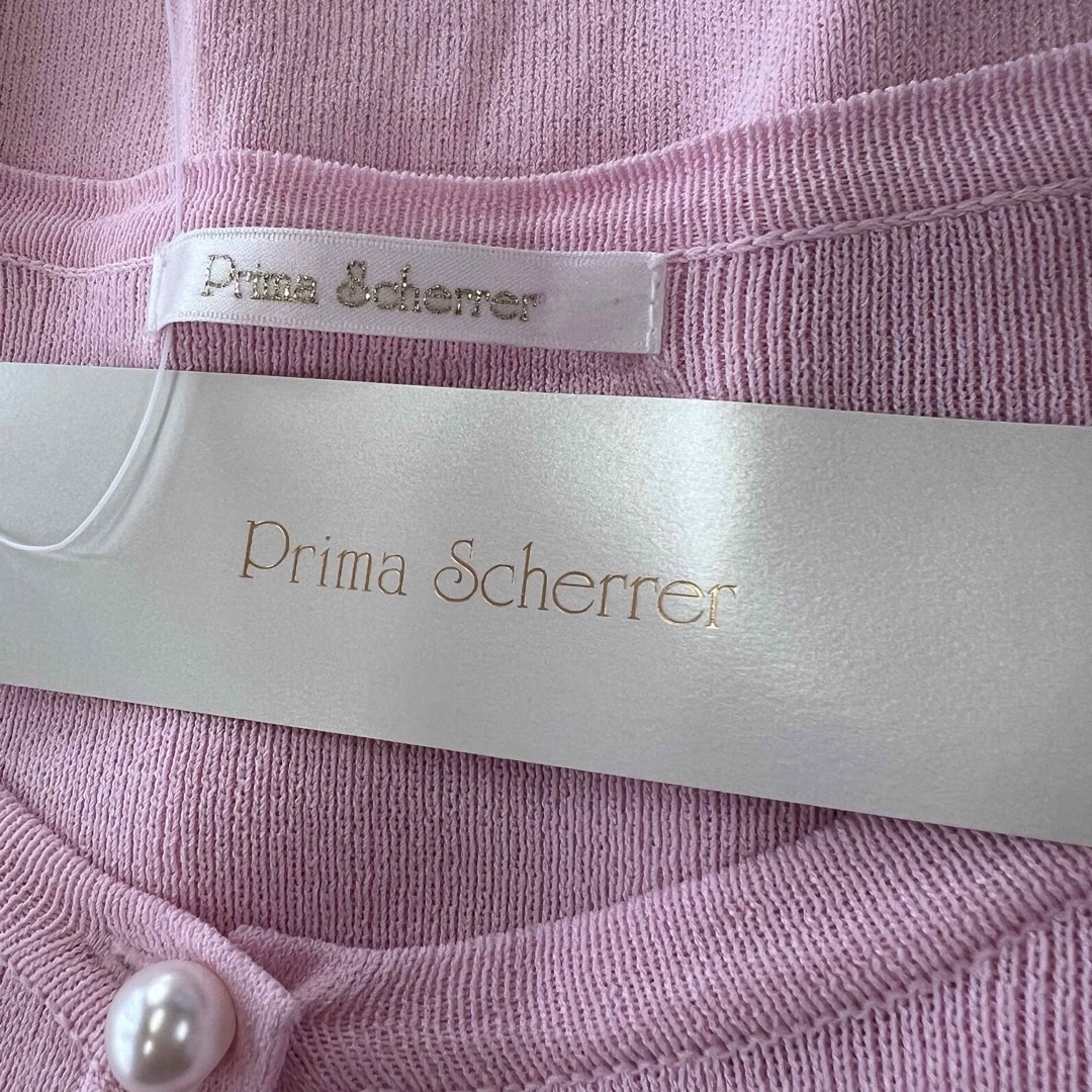 Prima Scherrer(プリマシェレル)のPrima Scherre  ニットカーディガン 2段フリル パールボタン  レディースのトップス(カーディガン)の商品写真