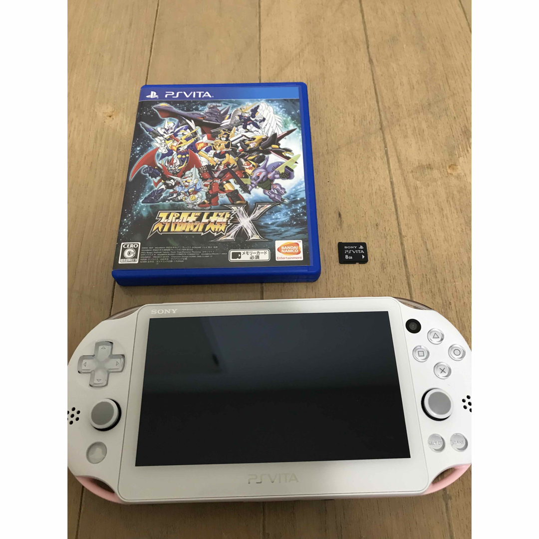 PlayStation Vita(プレイステーションヴィータ)のPlayStation vita PCH-2000 ピンク&ホワイト　ソフト付き エンタメ/ホビーのゲームソフト/ゲーム機本体(携帯用ゲーム機本体)の商品写真