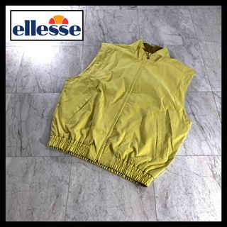 エレッセ(ellesse)の古着 ellesse 短丈 テック ナイロン ベスト 黄色 y2k 刺繍ロゴ(ベスト)