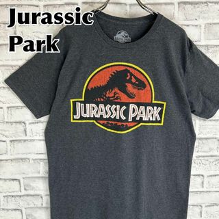 ティービーアンドムービー(TV&MOVIE)のJurassic Park ジュラシックパーク 恐竜 ロゴTシャツ 半袖 輸入品(Tシャツ/カットソー(半袖/袖なし))