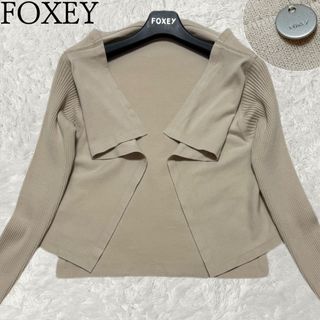 フォクシー(FOXEY)のフォクシー　ガレットカーディガン　後ろロゴプレートあり　長袖　トッパー　羽織(カーディガン)