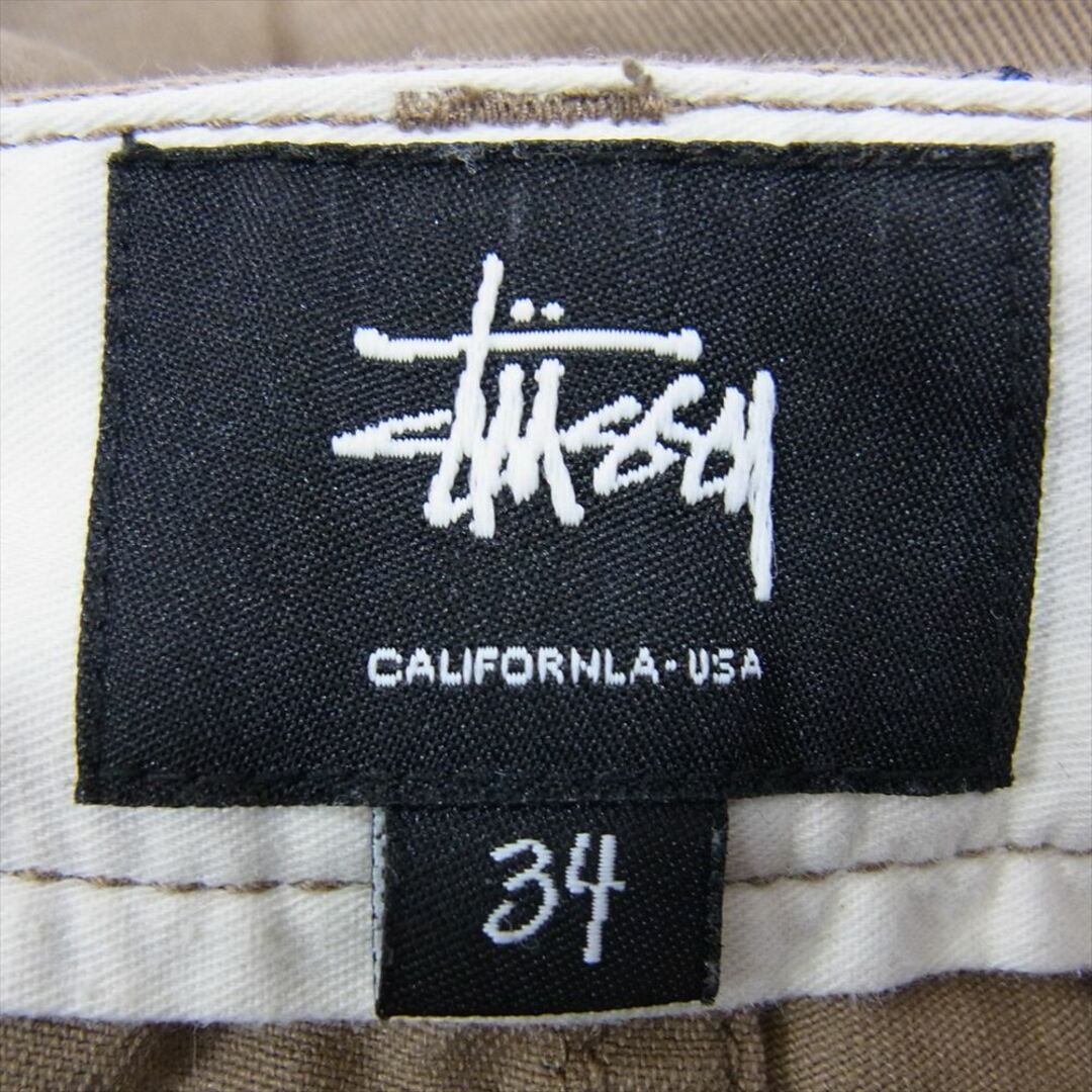 STUSSY(ステューシー)のSTUSSY ステューシー ドクロ刺繍 総柄 コットン ショート パンツ ブラウン系 34【中古】 メンズのパンツ(その他)の商品写真