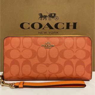 コーチ(COACH)の新品　コーチ　長財布　シグネチャー　オレンジ　ラウンドファスナー　小銭入れ有　(財布)