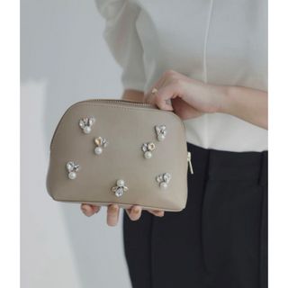 アニュアンス(ánuans)のanuans NOVELTY BIJOUX POUCH beige(ポーチ)