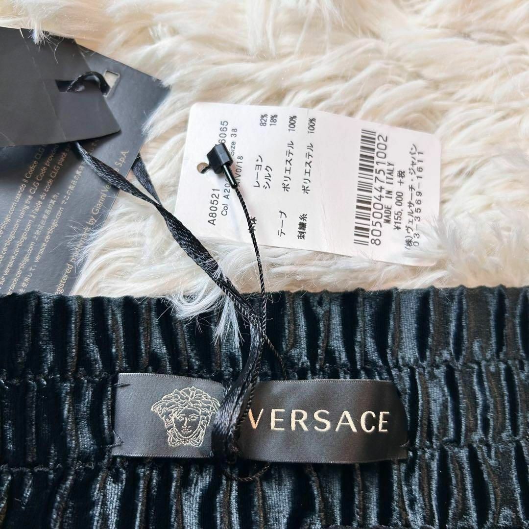 VERSACE(ヴェルサーチ)のタグ付 VERSACE 定価15.5万 シルクベロアフレアサイドラインパンツ 黒 メンズのパンツ(その他)の商品写真