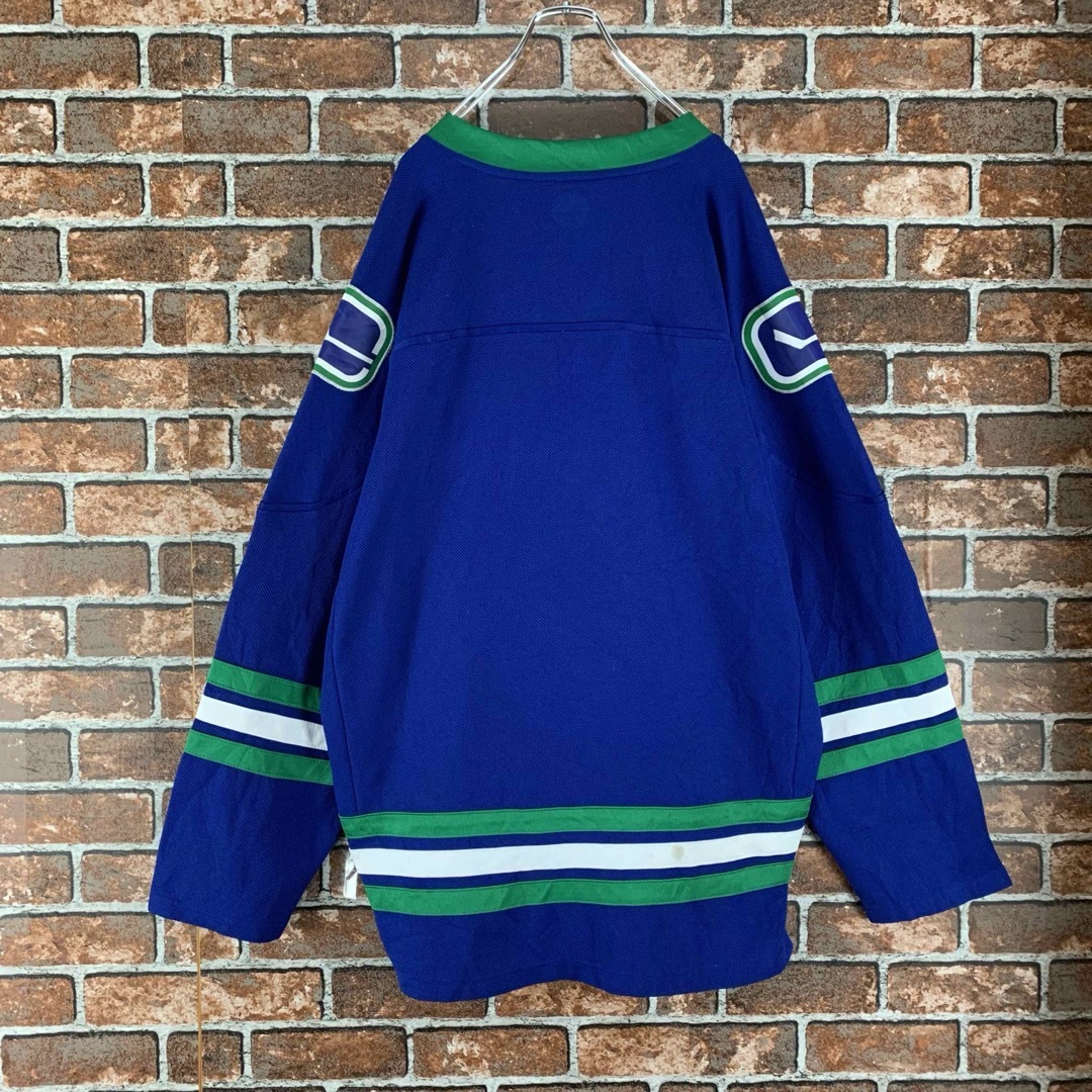 【即完売】NHL　バンクーバー・カナックス　ビッグサイズ　ブルー　ゲームシャツ メンズのトップス(Tシャツ/カットソー(七分/長袖))の商品写真