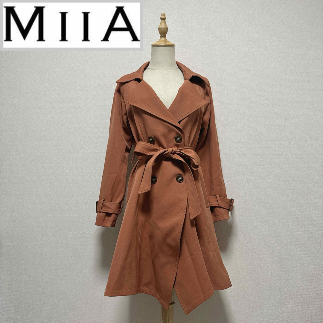 MIIA(ミーア)のミーア　ヘムトレンチコート　オレンジ レディースのジャケット/アウター(トレンチコート)の商品写真