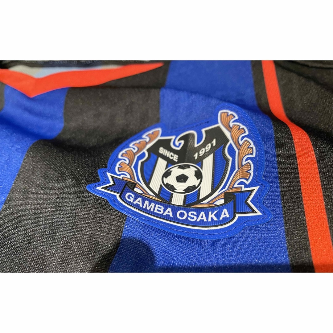 UMBRO(アンブロ)の【中古美品】ガンバ大阪　遠藤保仁選手サイン入り　2014年版ユニフォーム　160 スポーツ/アウトドアのサッカー/フットサル(ウェア)の商品写真