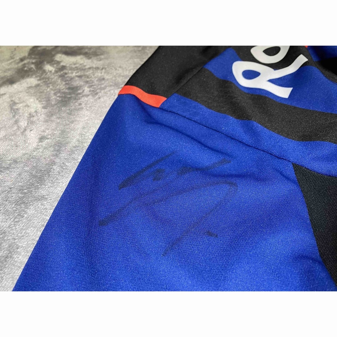 UMBRO(アンブロ)の【中古美品】ガンバ大阪　遠藤保仁選手サイン入り　2014年版ユニフォーム　160 スポーツ/アウトドアのサッカー/フットサル(ウェア)の商品写真