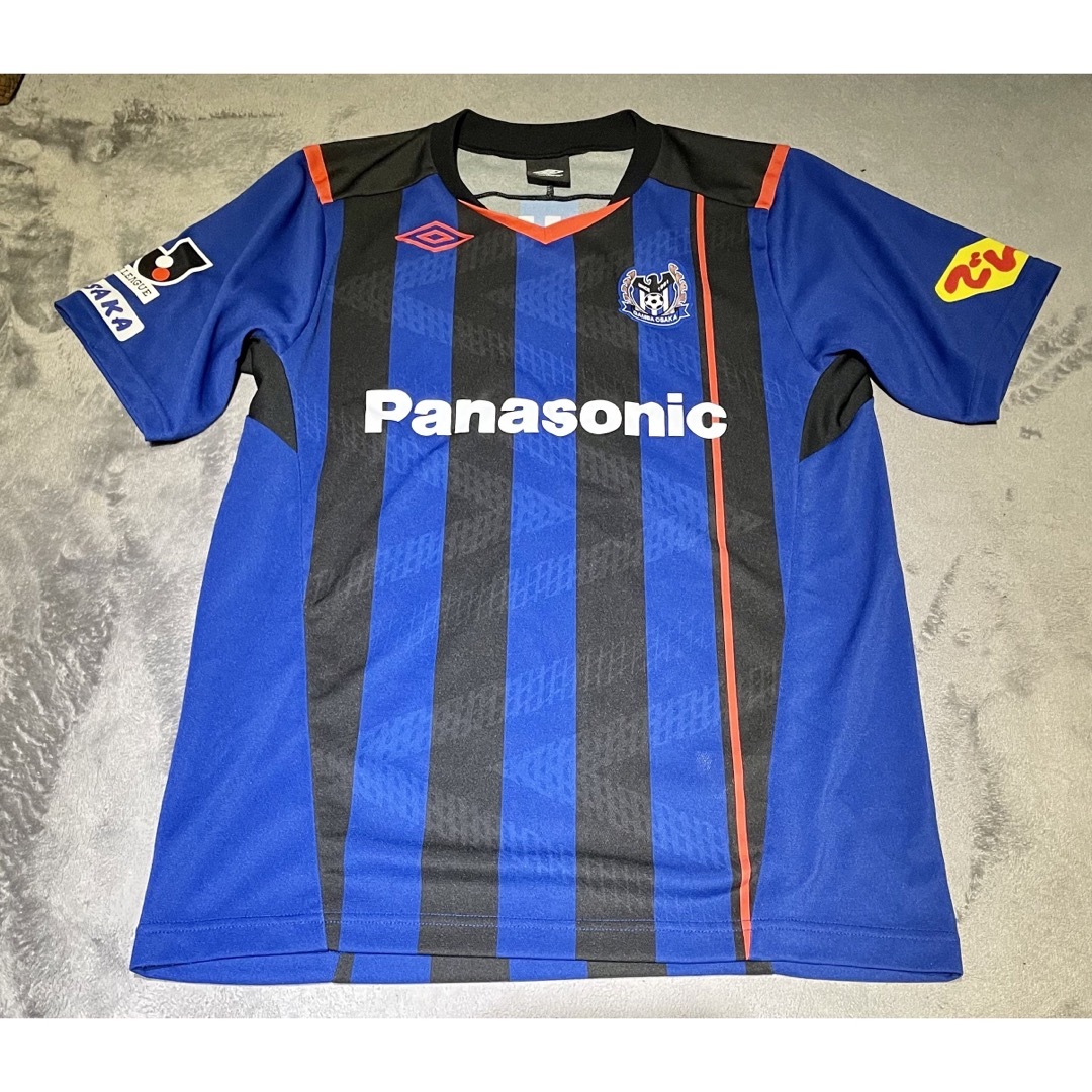 UMBRO(アンブロ)の【中古美品】ガンバ大阪　遠藤保仁選手サイン入り　2014年版ユニフォーム　160 スポーツ/アウトドアのサッカー/フットサル(ウェア)の商品写真