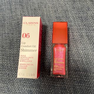 クラランス(CLARINS)のCLARINS コンフォート リップオイル シマー #06 Pop Coral(リップグロス)