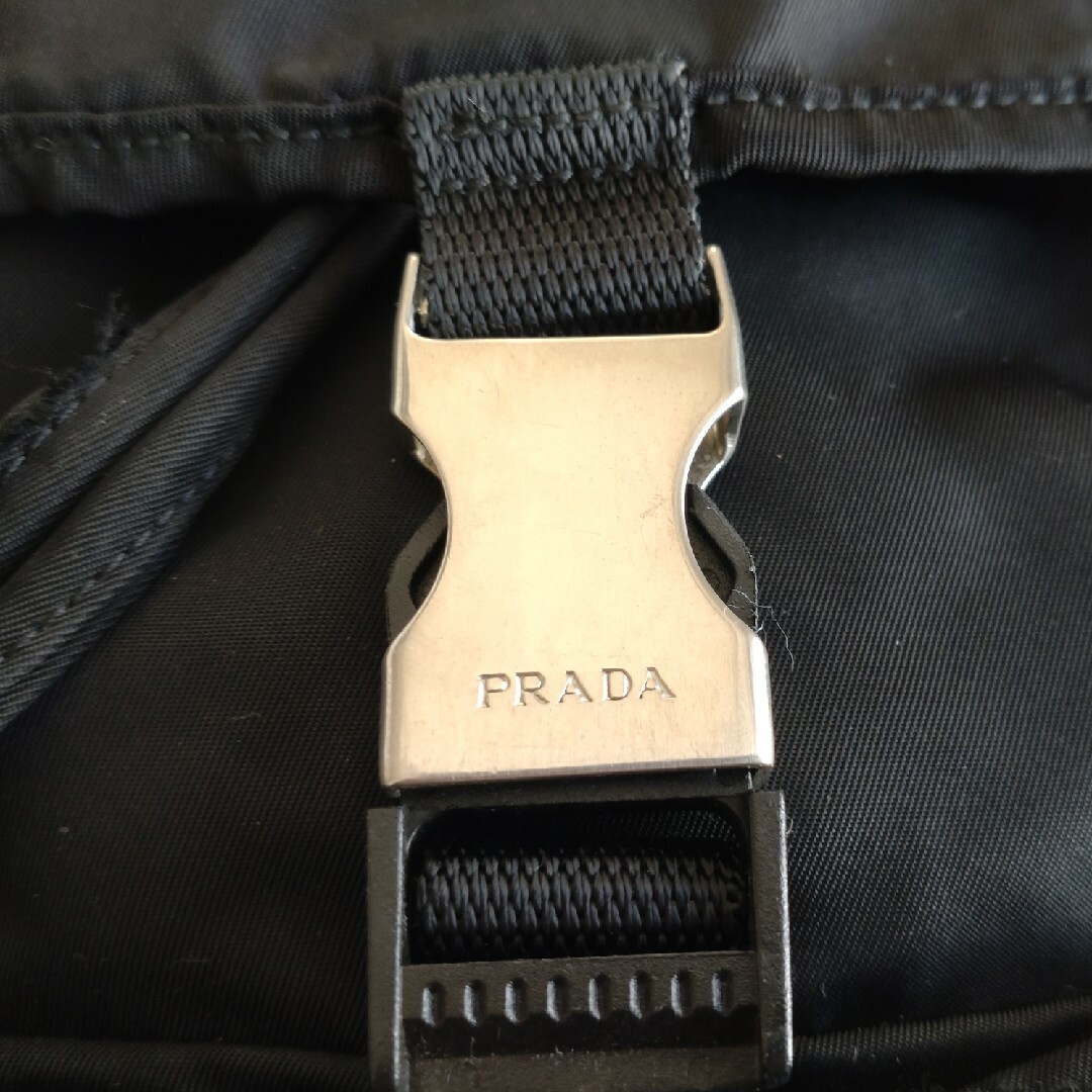 PRADA(プラダ)の【プラダ】匿名配送 PRADA ミニリュック ブラック 三角ロゴ 白タグ レディースのバッグ(リュック/バックパック)の商品写真