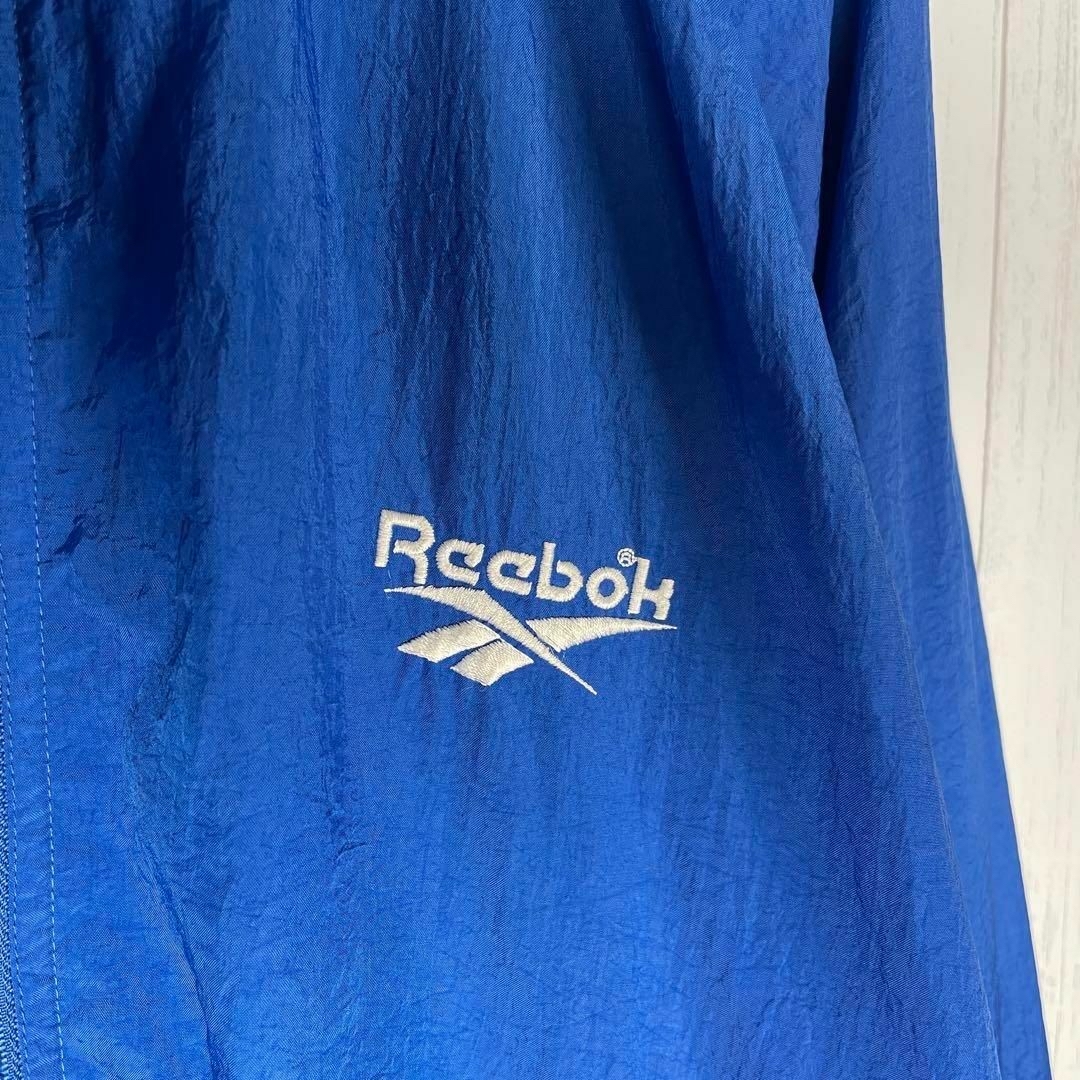 Reebok(リーボック)の[古着]リーボック　アノラックジャケット　バック刺繍　ラグラン　ジップアップ　青 その他のその他(その他)の商品写真