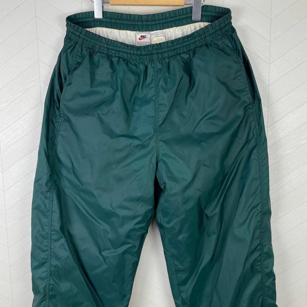 NIKE(ナイキ)の超激レア 90s ナイキ トラックパンツ 緑 裾ロゴ 刺繍 ワイド ルーズ XL メンズのパンツ(その他)の商品写真