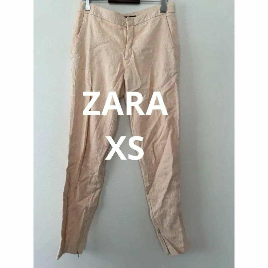 ZARA(ザラ)のZARA WOMAN ストレートパンツ レース柄 ベージュ ピンク系 サイズXS レディースのパンツ(カジュアルパンツ)の商品写真