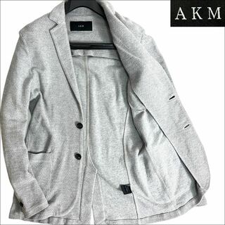エイケイエム(AKM)のJ3013美品 AKM 黒タグカラミジャージーテーラードジャケット グレー XL(テーラードジャケット)