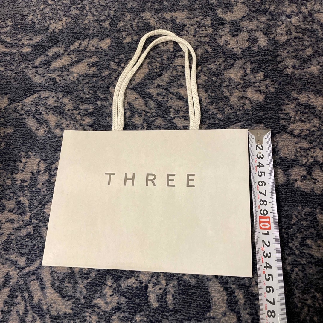 THREE(スリー)のTHREE 紙袋 レディースのバッグ(ショップ袋)の商品写真