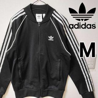 オリジナルス(Originals（adidas）)のアディダス 黒 スーパースター トラックジャケット SST ジャージ 男性M(ジャージ)