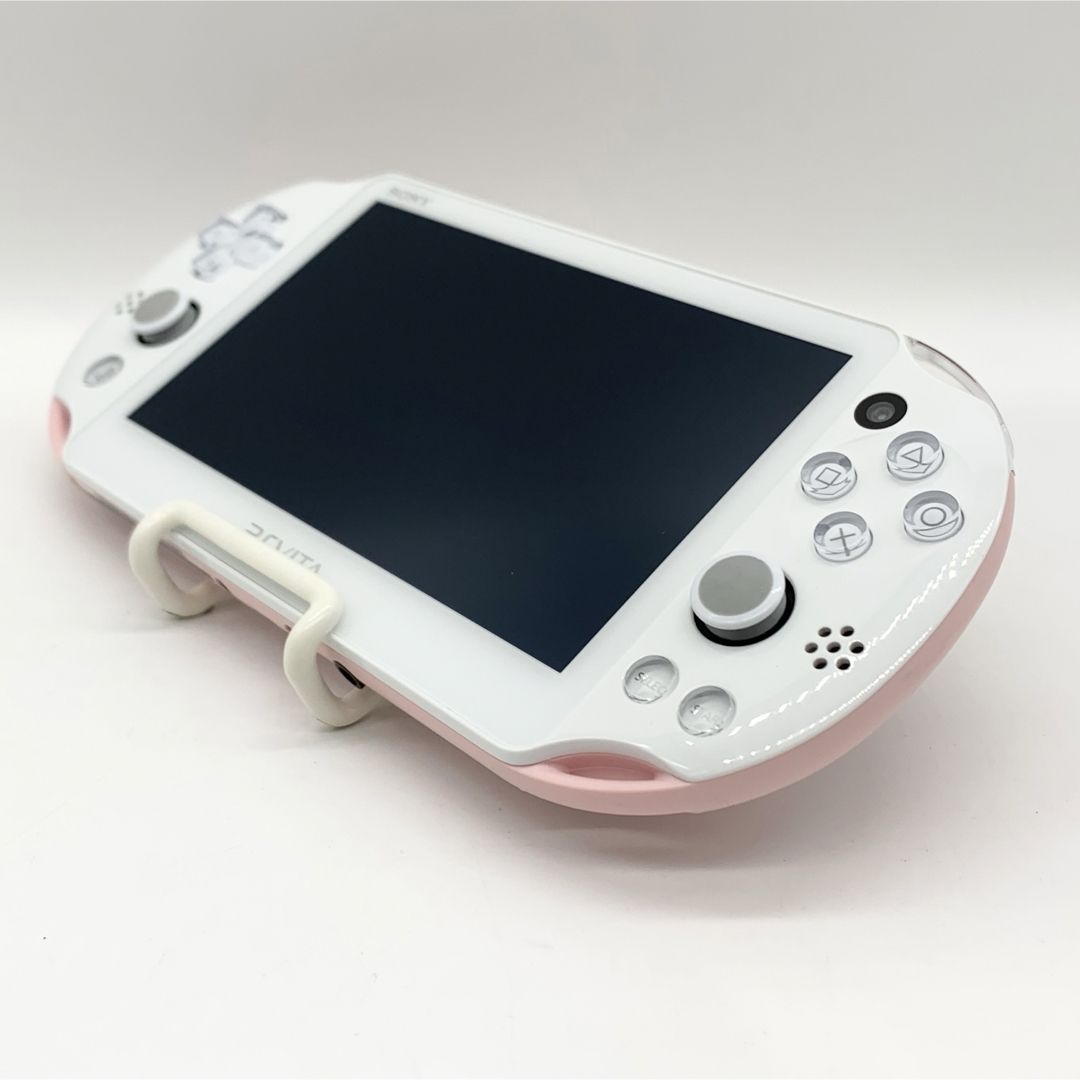 PlayStation Vita(プレイステーションヴィータ)の【液晶美品】PSvita ライトピンク ホワイト PCH-2000 本体 エンタメ/ホビーのゲームソフト/ゲーム機本体(携帯用ゲーム機本体)の商品写真