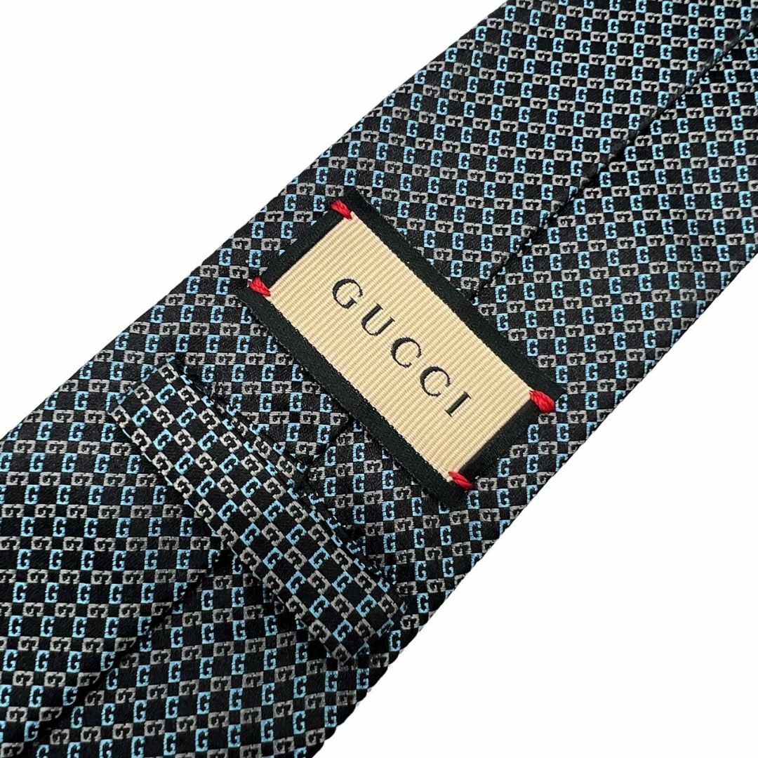 Gucci(グッチ)のGUCCI　グッチ　ネクタイ　GGロゴ　総柄　GGパターン　シルク　光沢ネクタイ　ブルー　グレー　ブラック　絹　メンズ　パーティ用　普段用　オシャレ　小物　男性 メンズのファッション小物(ネクタイ)の商品写真