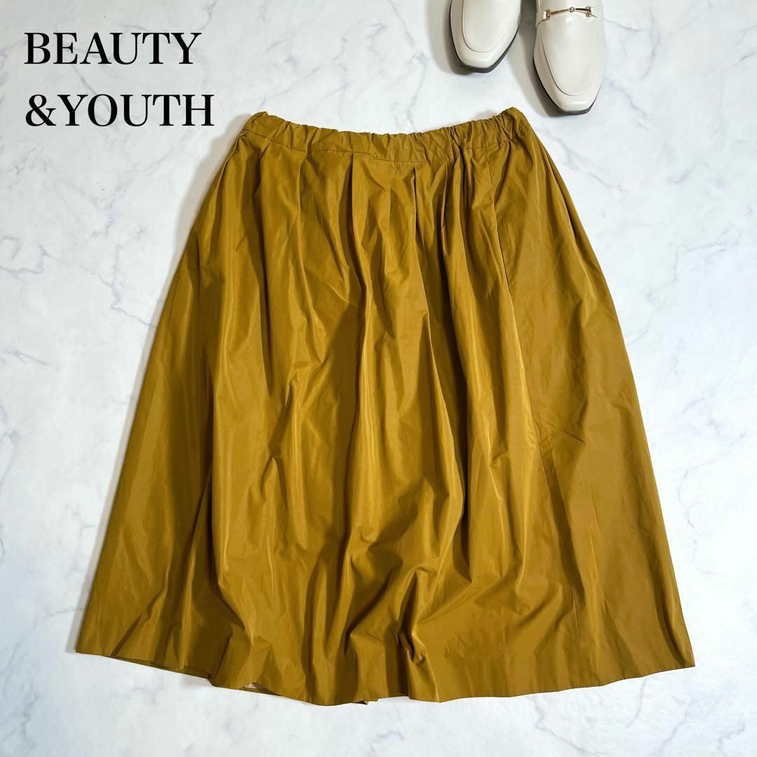 BEAUTY&YOUTH UNITED ARROWS(ビューティアンドユースユナイテッドアローズ)のBEAUTY&YOUTH タックフレアスカート　膝下　キャメル　ウエストゴム レディースのスカート(ひざ丈スカート)の商品写真