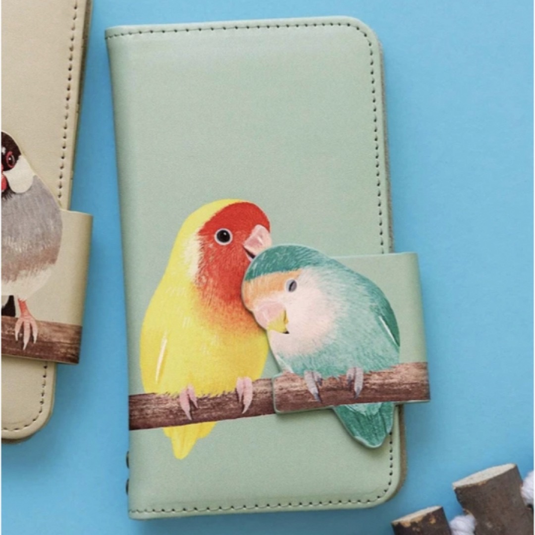 FELISSIMO(フェリシモ)の寄り添うコザクラインコのマルチスマホカバー　サイズ2 新品　フェリシモ スマホ/家電/カメラのスマホアクセサリー(iPhoneケース)の商品写真