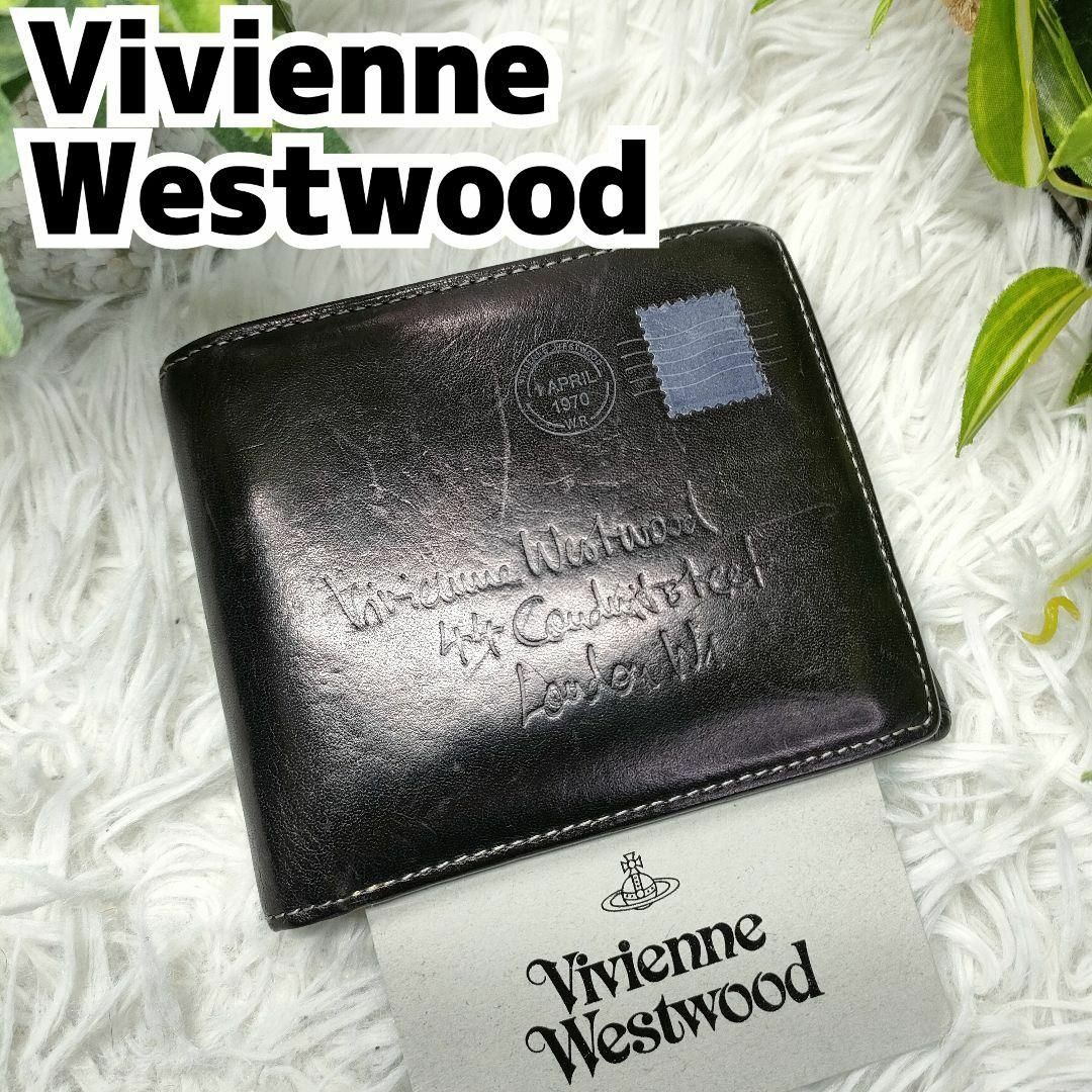 Vivienne Westwood(ヴィヴィアンウエストウッド)のヴィヴィアンウエストウッド 二つ折り財布 ブラック オーブ 切手 カーフレザー レディースのファッション小物(財布)の商品写真