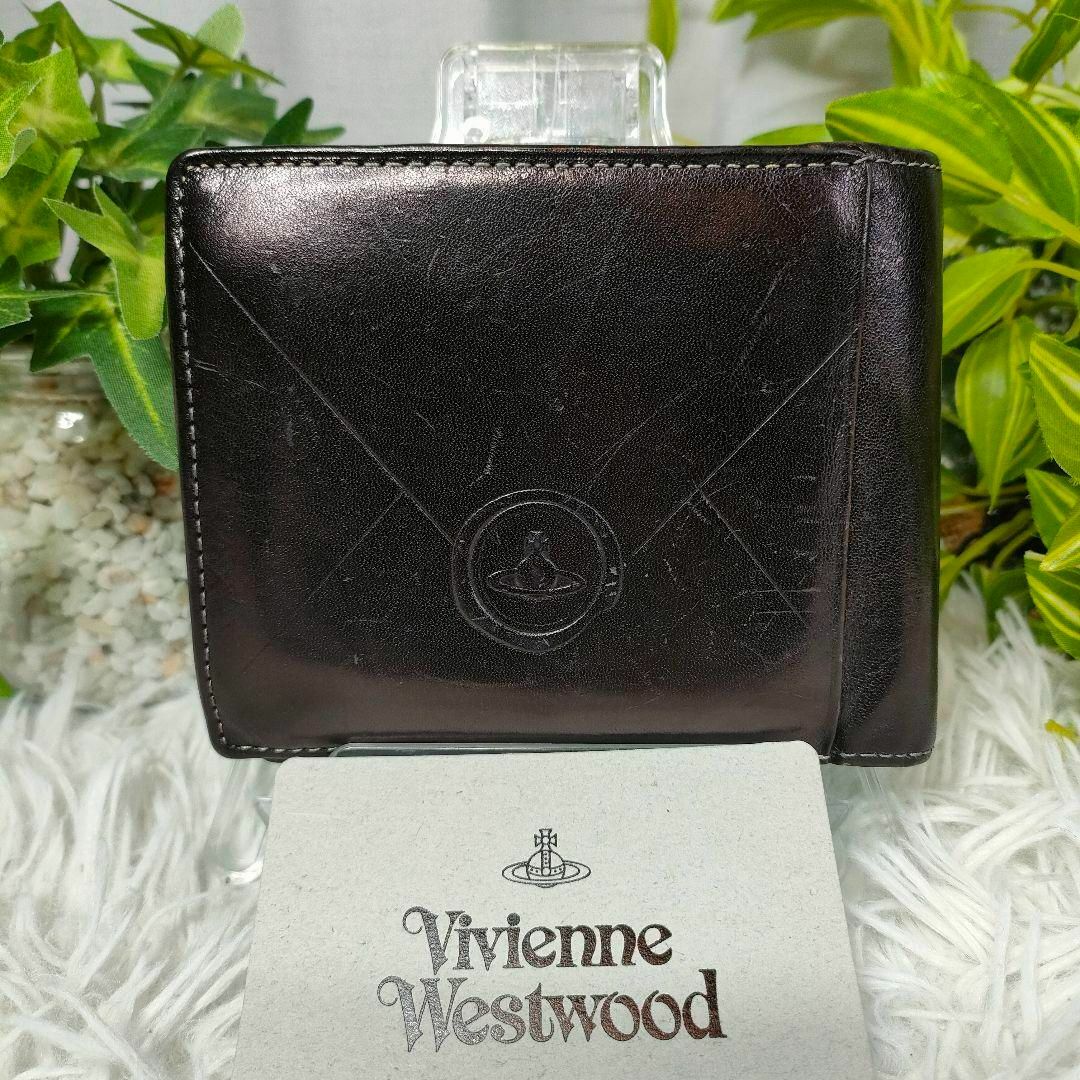 Vivienne Westwood(ヴィヴィアンウエストウッド)のヴィヴィアンウエストウッド 二つ折り財布 ブラック オーブ 切手 カーフレザー レディースのファッション小物(財布)の商品写真